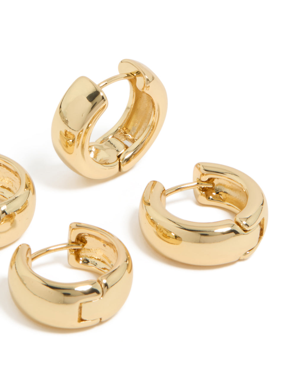 Highlighting gold plated huggie earrings in a 2-pack post detail view