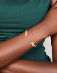 Featuring a gold plated double knotted centre wrist cuff with dainty styling on wrist view - link has visual effect only