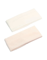Discover solid 2-pack ivory and pink stretch headbands front view - link has visual effect only