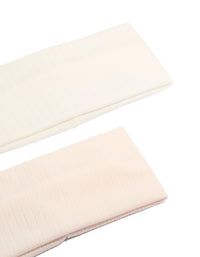 Featuring solid pointelle fabric stretch headbands in a 2-pack with ivory and pink colorways detail view - link has visual effect only