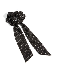 Showcasing a polkadot fabric micro spot long scarf in black and white front view - link has visual effect only