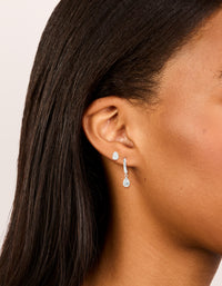 Featuring silver plated cubic zirconia hoop and stud earrings 2-pack on ear view - link has visual effect only