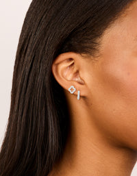 Featuring silver plated cubic zirconia flower stud and huggie earrings 2-pack on ear view - link has visual effect only