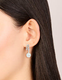 Elegant silver plated cubic zirconia illusion pearl drop earrings with hoop closure on ear view - link has visual effect only