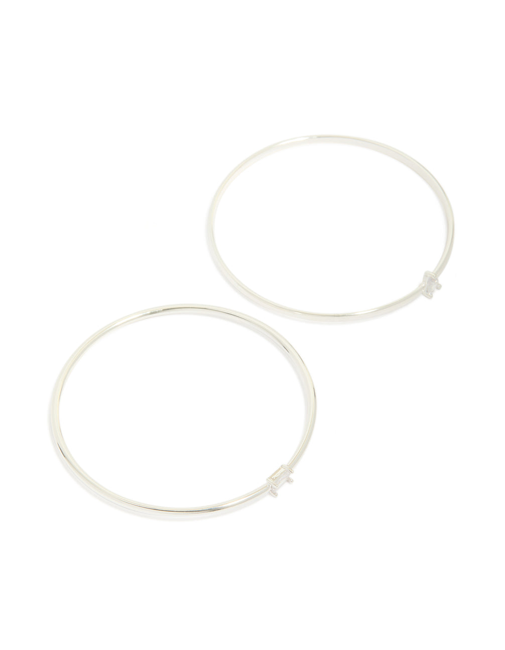 Beautifully crafted silver plated rectangular and teardrop cubic zirconia bangles in a 2-pack front view