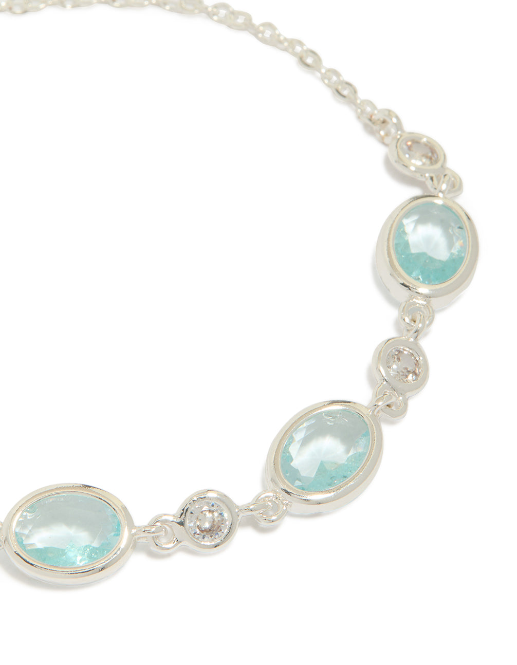 Presenting a silver plated blue cubic zirconia large bezel trio toggle bracelet with statement design close up view