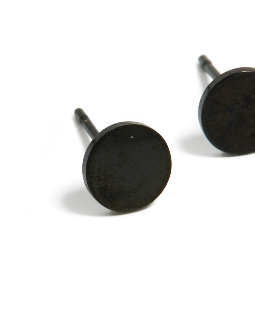 Showcasing 6 MM disc stud earrings in waterproof black coated stainless steel close up view