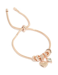 Showcasing a rose gold plated diamante heart charm toggle bracelet with dainty styling front view - link has visual effect only