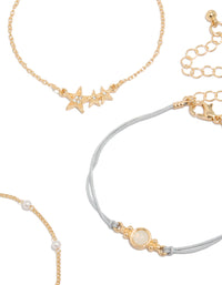 Designed with gold pearl and light blue cord bracelets in a 4-pack featuring celestial star and moon elements closure detail view - link has visual effect only