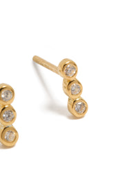 Highlighting gold plated sterling silver cubic zirconia bezel trio drop stud earrings with clear accents post detail view - link has visual effect only