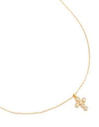 Showcasing a cross pendant necklace crafted from cubic zirconia with sterling silver and gold plated finish close up view - link has visual effect only