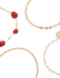 Highlighting gold dainty pearl and red beaded chain bracelets 4-pack close up view - link has visual effect only