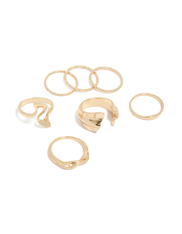 Showcasing gold dainty organic rings in a 7-pack front view