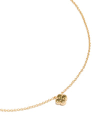 Showcasing a gold plated peridot August flower necklace with floral pendant in dainty design close up view - link has visual effect only