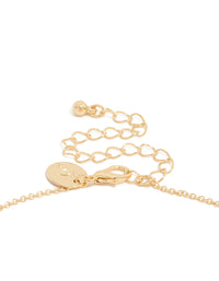 Highlighting a gold plated peridot August flower necklace with floral pendant, hoop closure, and dainty design clasp detail view - link has visual effect only