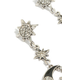 Showcasing antique silver edgy star moon drop earrings with celestial charm details close up view - link has visual effect only