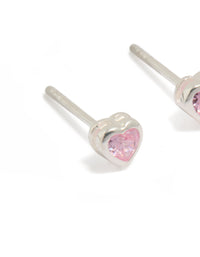Highlighting sterling silver pink cubic zirconia heart earrings close up view - link has visual effect only