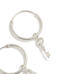 Beautiful statement hoop earrings crafted from sterling silver with heart and key featuring padlock detail close up view - link has visual effect only