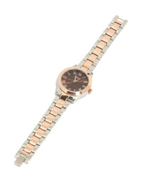 Elegant mixed metal watch with brown roman numeral dial, round shape, formal occasion, women's analog timepiece, link band in multi-color, gold and silver tones front view - link has visual effect only