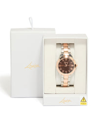 Elegant mixed metal watch with brown roman numeral dial, round shape, formal occasion, women's analog timepiece, link band in multi-color, gold and silver tones case detail view - link has visual effect only