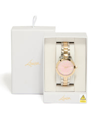 Beautifully presented mixed metal pink face roman numeral watch with numbers on a round dial, designed for women in casual wear, featuring a multi-color link band and analog type case detail view - link has visual effect only