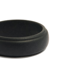 Highlighting a waterproof mens black silicone band ring close up view - link has visual effect only