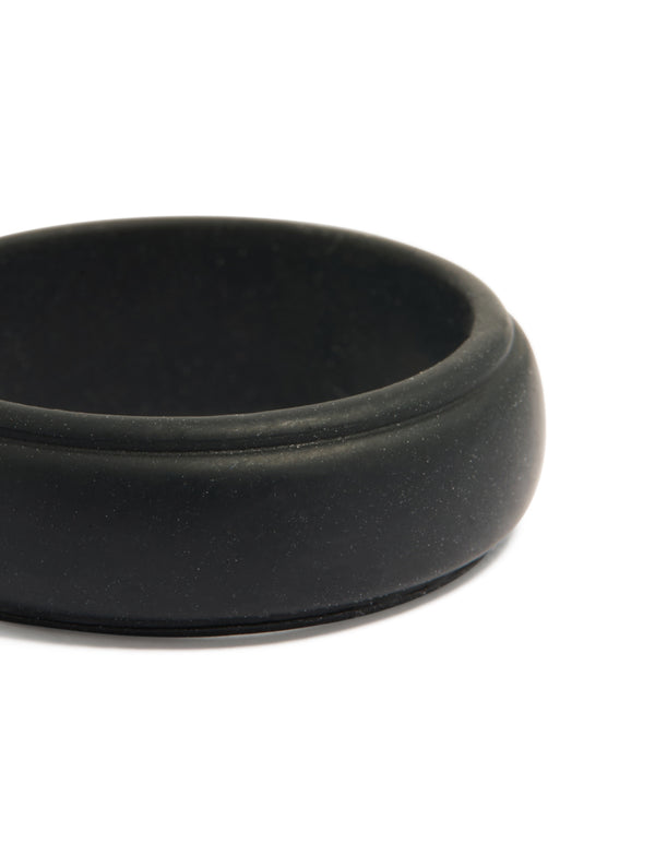 Highlighting a waterproof mens black silicone band ring close up view