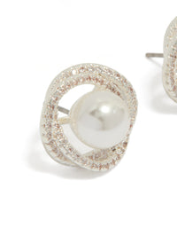 Crafted from silver plated metal, these cubic zirconia and pearl twist stud earrings are shown in close up view - link has visual effect only