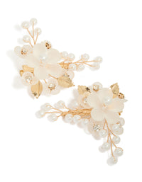 Presenting a gold plated pearl and acrylic flower clip featuring leaf accents and floral details in ivory and white front view - link has visual effect only