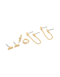 Showcasing celestial earrings with moon and star designs, crafted from cubic zirconia in a 4-pack featuring huggie and stud closures front view - link has visual effect only