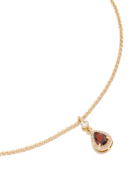 Showcasing a gold red pear cubic zirconia pendant necklace with statement styling close up view - link has visual effect only