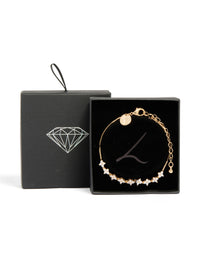 Featuring a floral cubic zirconia bracelet in gold with a statement style close up view - link has visual effect only