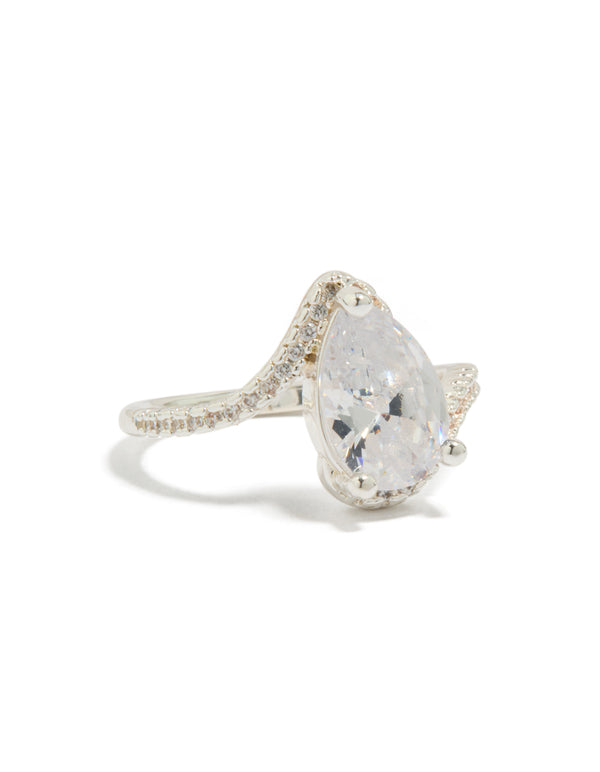 Showcasing a silver plated pear cubic zirconia engagement ring with crystal accents and statement design in clear side detail view