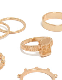 Highlighting gold mixed textured signet rings 10-pack with beaded detailing, oval and chunky design close up view - link has visual effect only