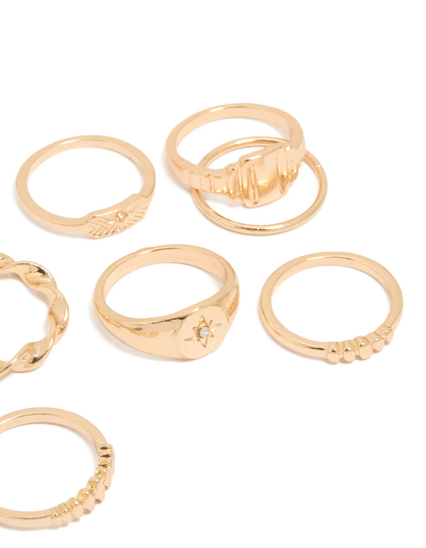 Crafted from gold, statement signet and ribbed rings with celestial star in a 10-pack side detail view