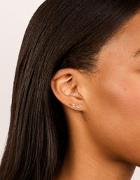 Showcasing silver crawler studs featuring marquise cut cubic zirconia stones in waterproof stainless steel and flat back closure on ear view - link has visual effect only