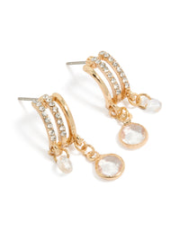 Showcasing gold diamante drop layered huggie earrings with charm closure front view - link has visual effect only