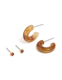 Featuring gold tortoiseshell acrylic hoop and stud earrings in a 2-pack front view - link has visual effect only