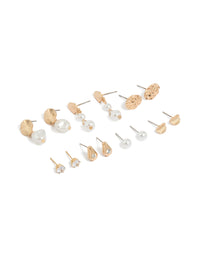Featuring gold organic shape and pearl stud earrings in a 7-pack front view - link has visual effect only