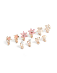 Featuring clip-on earrings in a 5-pack with floral design, pearl accents, and rose gold finish front view - link has visual effect only