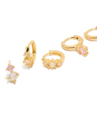 Discover mini double cubic zirconia studs and huggie earrings in a 3-pack set with crystal detailing and gold plated finish close up view - link has visual effect only