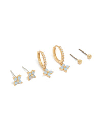 Showcasing gold plated blue flower stud and huggie earrings in a 3-pack in powder blue accents front view - link has visual effect only