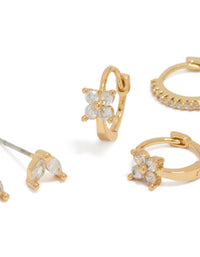 Showcasing mini flower dainty huggie and stud earrings in a 3-pack with gold plated cubic zirconia detailing close up view - link has visual effect only