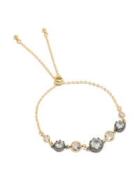 Featuring a mixed metal plated toggle bracelet with cubic zirconia and crystal accents in gold, silver, and clear front view - link has visual effect only