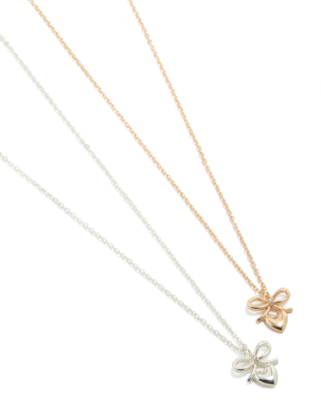 Showcasing mixed metal bow and heart pendant necklaces in gold and silver 2-pack close up view