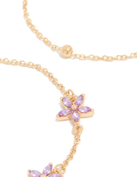 Crafted with delicate chain links featuring diamante lavender floral and gold beads close up view - link has visual effect only