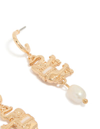 Designed gold hoop earrings featuring a freshwater pearl and an animal elephant charm with ivory accents post detail view - link has visual effect only