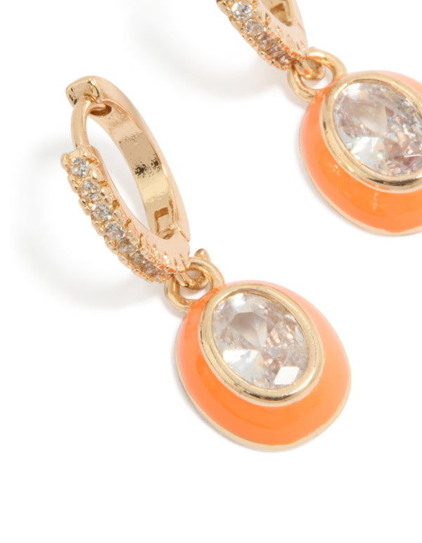 Beautifully crafted gold cubic zirconia orange enamel outer oval huggie earrings statement style in clear close up view