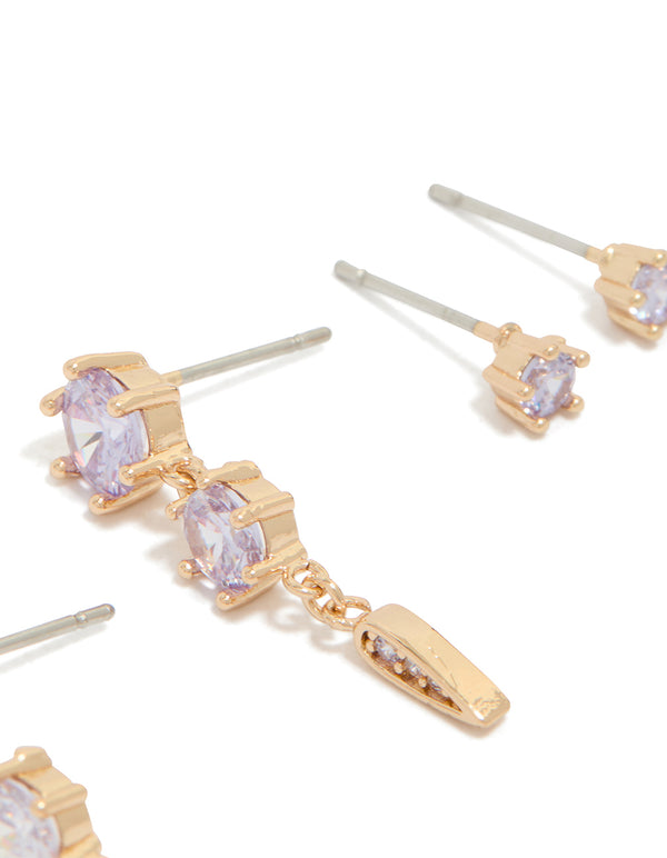 Showcasing gold lilac cubic zirconia stud and drop earrings in a 2-pack with crystal closures close up view