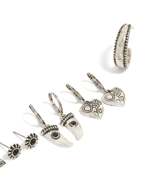 Featuring antique silver gothic tooth and cross earrings with charm accents including heart, evil eye, and sun designs in a 6-pack close up view